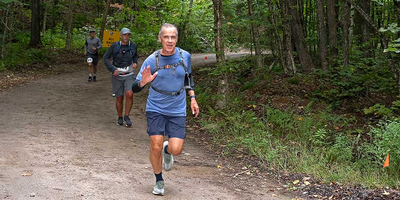 Carney surprises many with appearance at long-distance trail race