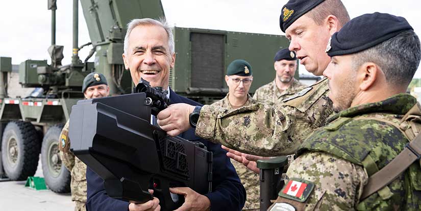 Carney tours Latvian military base to wrap up European trip