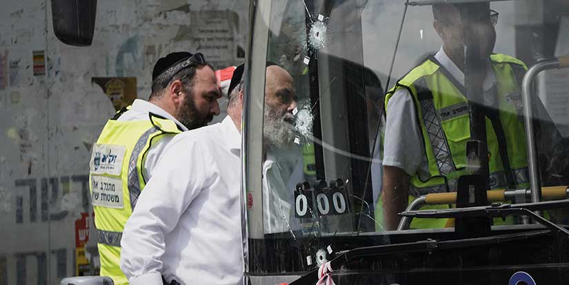 Palestinian gunmen kill 6 people in attack on Jerusalem bus stop